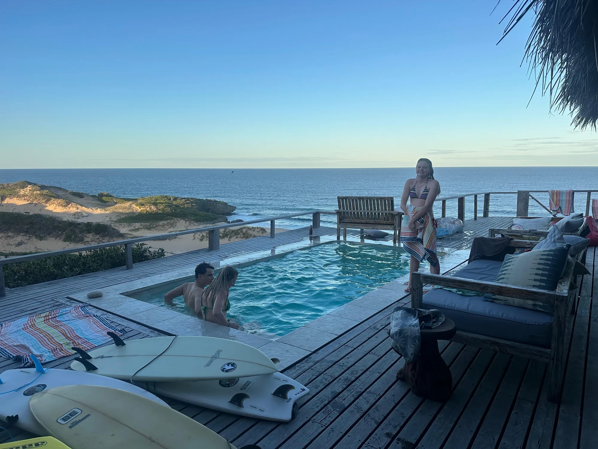 Guests enjoying the pool in the evening