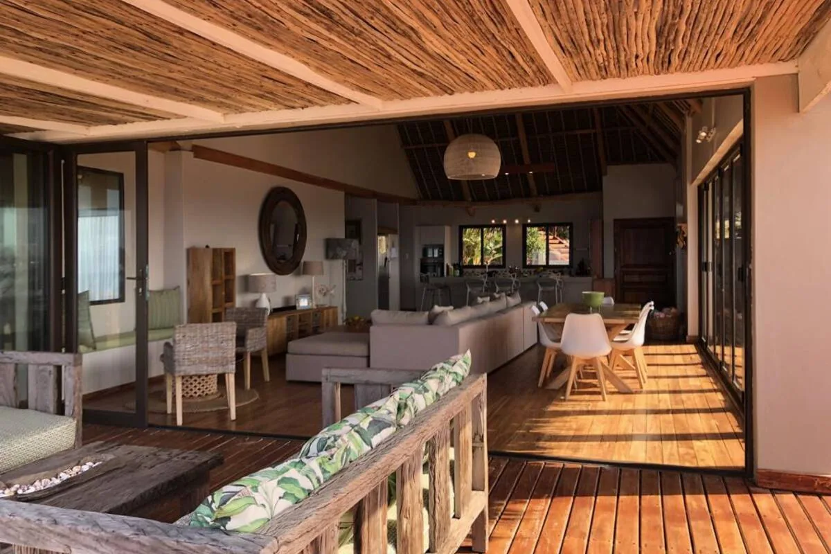 Open-plan living space opening to the deck